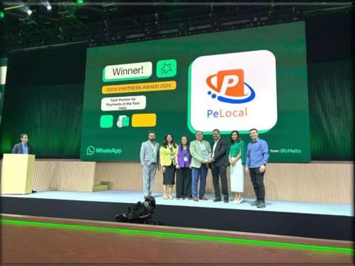 The Pelocal team on stage receiving the India Partners Award 2024, the screen behind them reading Winner, Tech Partner for Payments for the Year, India, beside the Pelocal logo and the WhatsApp and Meta marks.